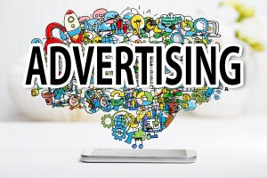 Advertising concept with smartphone on white table